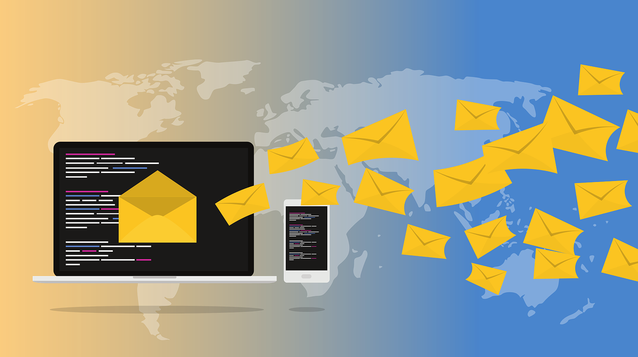 WordPress Mail. Mail is entering a computer and that computer is next to a phone. Behind those images seems to be an atlas. Image by Muhammad Ribkhan from Pixabay