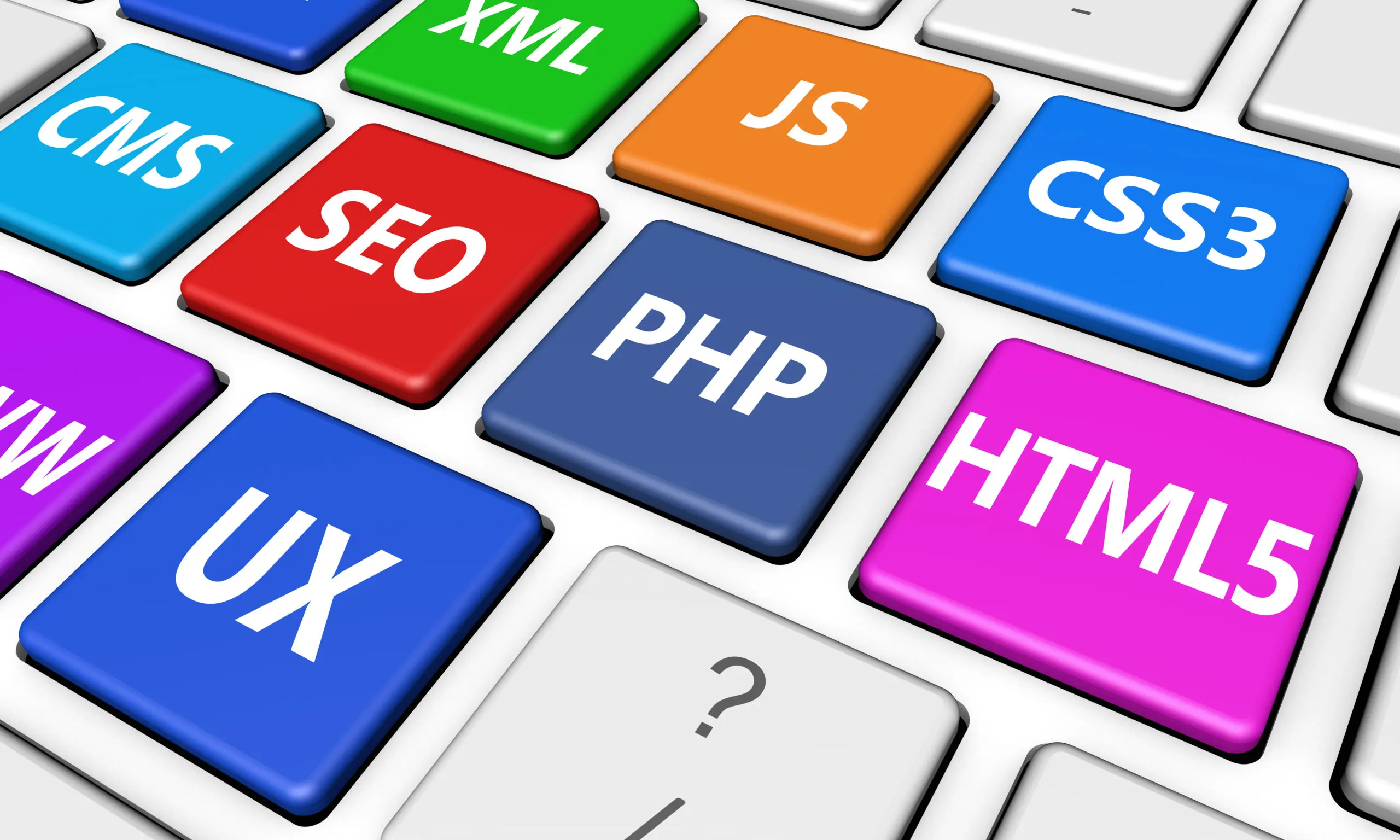 Web design, Internet and SEO development concept with programming language sign on colorful computer keyboard buttons. Image used with an Adobe license.