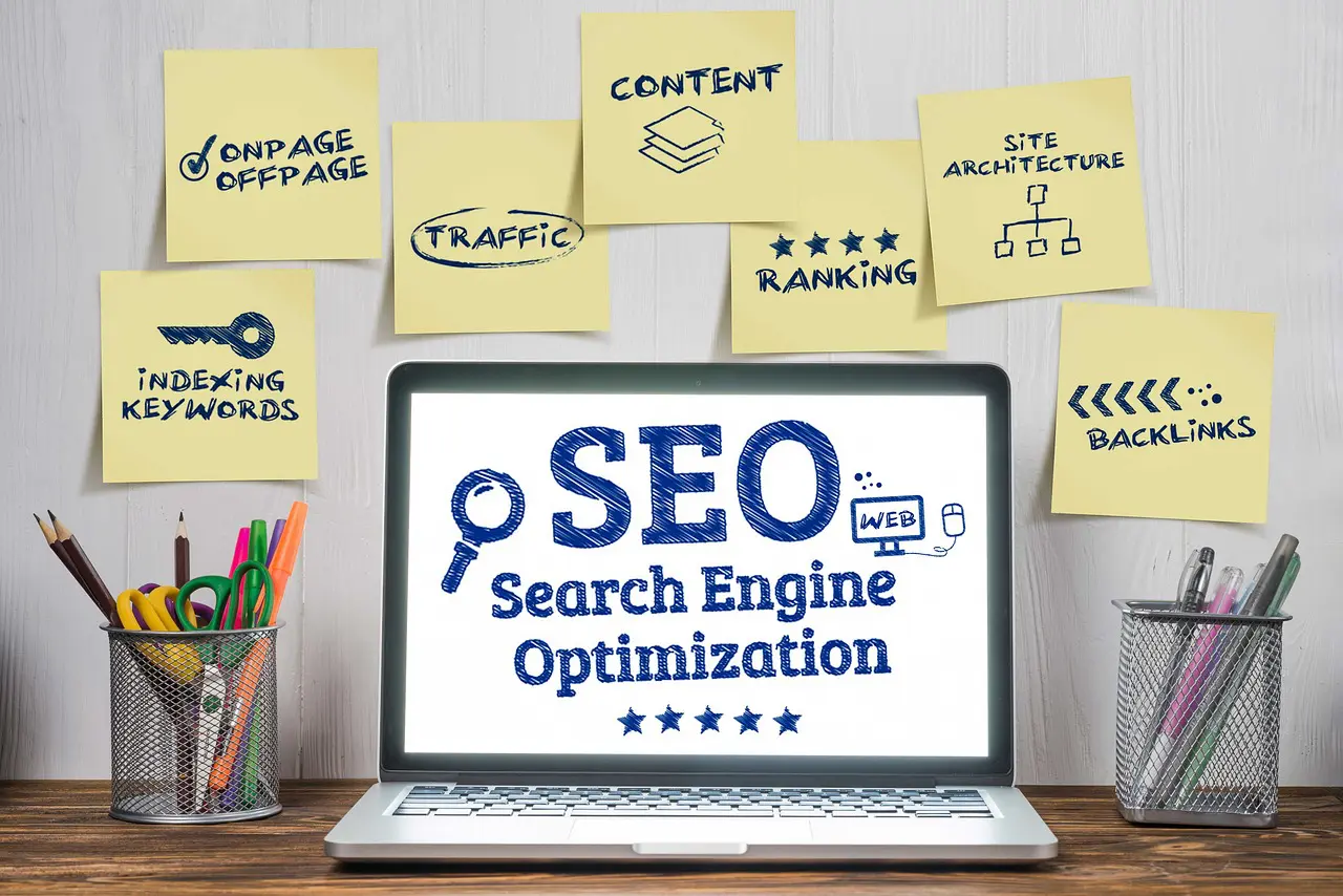 Search Engine Optimization Orange County. Orange County SEO Company. SEO Company Orange County. The words Search engine optimization displayed on a laptop. There are containers with pens, pencils and scissors on the left and right of the laptiop. This image was found on Pixabay and is used according to Pixabay's license.